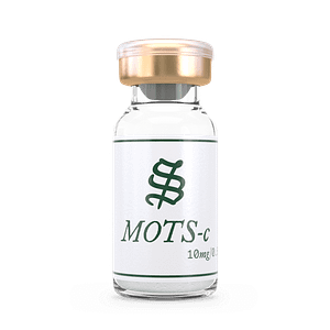 A small glass vial with a gold and white cap, labeled MOTS-c 10mg with a green emblem above the text. The vial contains a white, powder-like substance.