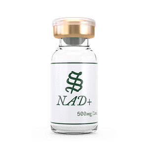 A clear glass vial with a gold cap labeled NAD+ and 500mg/1mL in green on a white background, containing a transparent liquid solution.